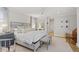 Bright bedroom with hardwood floors, upholstered bed frame, and decorative bench at 480 Wimbledon Ne Rd, Atlanta, GA 30324