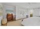 Bedroom with wood floors, king size bed, shuttered doors, and rustic wooden desk at 480 Wimbledon Ne Rd, Atlanta, GA 30324