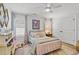 Charming bedroom with plush bedding, a ceiling fan, and lots of natural light at 480 Wimbledon Ne Rd, Atlanta, GA 30324