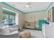 Adorable Bedroom featuring unique wallpaper, a gold crib, and plenty of natural light at 480 Wimbledon Ne Rd, Atlanta, GA 30324