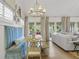Dining area adjacent to the living room features stylish seating and natural light from french doors at 480 Wimbledon Ne Rd, Atlanta, GA 30324