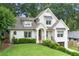 Charming two-story white brick home with a manicured lawn and inviting front entrance at 480 Wimbledon Ne Rd, Atlanta, GA 30324