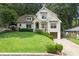 Beautiful two-story home with a well-maintained lawn and a private driveway at 480 Wimbledon Ne Rd, Atlanta, GA 30324