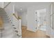 Hallway with hardwood floors and gray carpeted staircase leading to the second floor at 480 Wimbledon Ne Rd, Atlanta, GA 30324