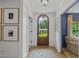 Elegant entryway featuring hardwood floors, an arched doorway, and stylish decor at 480 Wimbledon Ne Rd, Atlanta, GA 30324
