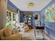 Stylish home office with blue walls, comfortable seating, and ample natural light at 480 Wimbledon Ne Rd, Atlanta, GA 30324