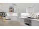 Bright white kitchen with stone countertops, stainless steel appliances, and stylish decor at 480 Wimbledon Ne Rd, Atlanta, GA 30324