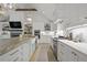 Modern kitchen with a large island, stainless steel appliances, and beautiful white cabinetry at 480 Wimbledon Ne Rd, Atlanta, GA 30324