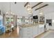 Well-appointed kitchen with island seating, farmhouse sink, and convenient access to the outdoor dining area at 480 Wimbledon Ne Rd, Atlanta, GA 30324
