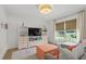 Inviting living room with custom shelving and plenty of natural light through the large windows at 480 Wimbledon Ne Rd, Atlanta, GA 30324