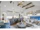 Open living and kitchen area with bright white features, large island, and custom lighting fixtures at 480 Wimbledon Ne Rd, Atlanta, GA 30324