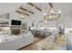 Open living space with vaulted ceilings, fireplace, and large kitchen island, perfect for entertaining at 480 Wimbledon Ne Rd, Atlanta, GA 30324
