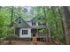Charming two-story home nestled among mature green trees at 488 Morris Rd, Hiram, GA 30141