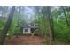 Charming two-story home nestled among mature green trees at 488 Morris Rd, Hiram, GA 30141