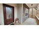 Inviting porch with decorative glass door, stone accents, and wood flooring at 488 Morris Rd, Hiram, GA 30141