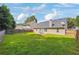 Spacious backyard featuring a patio and a lush lawn at 4920 Markim Forest Ln, Sugar Hill, GA 30518