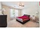 Cozy bedroom with a ceiling fan, window with curtains, and carpeted floor at 4920 Markim Forest Ln, Sugar Hill, GA 30518