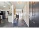 Inviting foyer with beautiful tile flooring and an open view into the living spaces at 4920 Markim Forest Ln, Sugar Hill, GA 30518