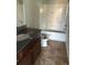 Clean bathroom featuring a modern vanity with granite countertop, and a tub-shower combination at 1900 Old Dogwood, Jonesboro, GA 30238