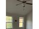 Bright bedroom with a ceiling fan and natural light from two windows at 1900 Old Dogwood, Jonesboro, GA 30238
