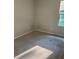 Neutral bedroom features carpeted floors and a window providing natural light at 1900 Old Dogwood, Jonesboro, GA 30238