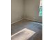 Minimalist bedroom with wall-to-wall carpeting, a window bringing in natural light, and neutral paint at 1900 Old Dogwood, Jonesboro, GA 30238