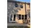 Exterior view shows siding, windows, back door and outdoor concrete patio at 1900 Old Dogwood, Jonesboro, GA 30238