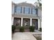Charming two-story home with a brick facade and a welcoming front porch with large supporting columns at 1900 Old Dogwood, Jonesboro, GA 30238