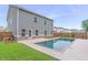 Backyard featuring a beautiful, private pool and well-maintained lawn at 939 Brittfield Way, Loganville, GA 30052