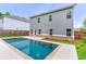 Spacious backyard featuring a large in-ground pool and lush green lawn at 939 Brittfield Way, Loganville, GA 30052