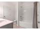 Bathroom with a shower/tub combo and gray and white decor at 939 Brittfield Way, Loganville, GA 30052