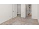 Empty bedroom with soft carpet and ensuite bathroom at 939 Brittfield Way, Loganville, GA 30052