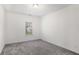Bright bedroom with a neutral carpet and single window at 939 Brittfield Way, Loganville, GA 30052