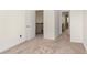 Bedroom with neutral carpet, light walls, and a white door at 939 Brittfield Way, Loganville, GA 30052