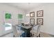 Bright dining area featuring modern decor, stylish table setting for four, and natural light at 939 Brittfield Way, Loganville, GA 30052