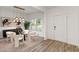Stylish dining area with modern light fixture and neutral tones at 939 Brittfield Way, Loganville, GA 30052