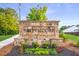 Stone sign for the 'Brittmoore' neighborhood entrance with colorful flower bed at 939 Brittfield Way, Loganville, GA 30052
