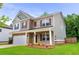 Charming home featuring a combination of brick and siding, enhancing its curb appeal at 939 Brittfield Way, Loganville, GA 30052