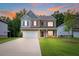 Beautiful two-story home with a well-manicured lawn and a spacious driveway at 939 Brittfield Way, Loganville, GA 30052