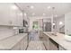 Modern kitchen with gray cabinets, stainless steel appliances, and granite countertops at 939 Brittfield Way, Loganville, GA 30052
