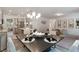Open-concept living space with modern furnishings, spacious layout, and seamless flow between kitchen and living areas at 939 Brittfield Way, Loganville, GA 30052
