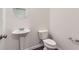 Clean half bathroom featuring pedestal sink and tile flooring at 3192 Spicy Cedar Lane Ln, Stonecrest, GA 30038