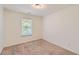 Comfortable bedroom with carpet flooring and a single window at 3192 Spicy Cedar Lane Ln, Stonecrest, GA 30038