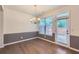 Dining room featuring hardwood floors, neutral paint, and modern chandelier at 3192 Spicy Cedar Lane Ln, Stonecrest, GA 30038