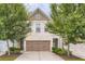 Charming two-story home with a brick facade, attached garage, and well-maintained landscaping at 3192 Spicy Cedar Lane Ln, Stonecrest, GA 30038