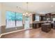 Bright kitchen with granite countertops, stainless appliances and adjacent dining area at 3192 Spicy Cedar Lane Ln, Stonecrest, GA 30038