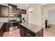 Modern kitchen with granite countertops, stainless steel appliances, and center island at 3192 Spicy Cedar Lane Ln, Stonecrest, GA 30038