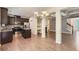 Open kitchen with stainless steel appliances, granite countertops, island, and hardwood floors at 3192 Spicy Cedar Lane Ln, Stonecrest, GA 30038