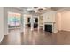Open concept living room featuring hardwood floors, fireplace, coffered ceilings, and elegant columns at 3192 Spicy Cedar Lane Ln, Stonecrest, GA 30038