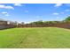 Expansive green backyard with a wood fence; great for entertaining and enjoying outdoor activities at 850 Ethereow Ct, Lawrenceville, GA 30046